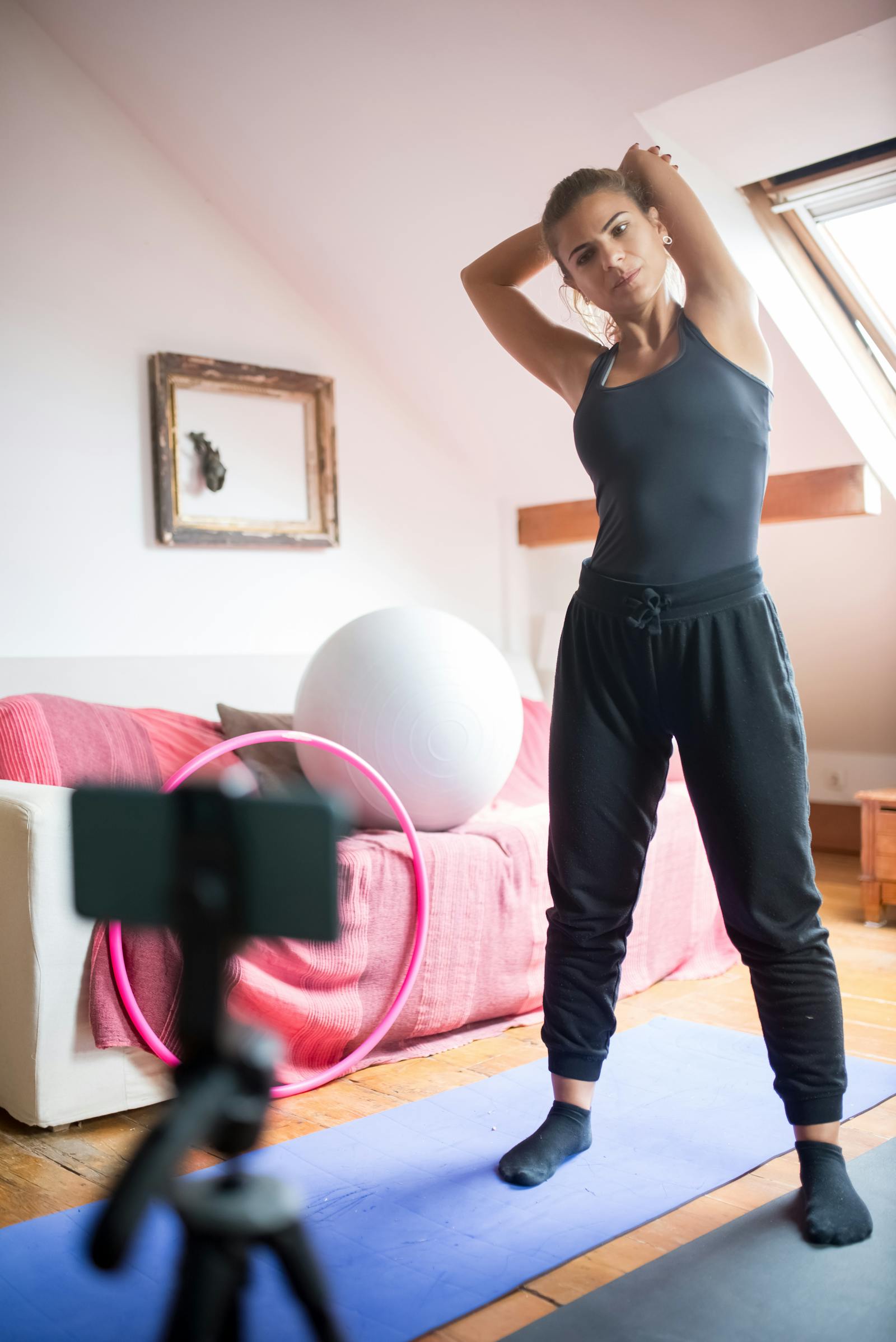 Member recording a workout clip to share with a virtual trainer