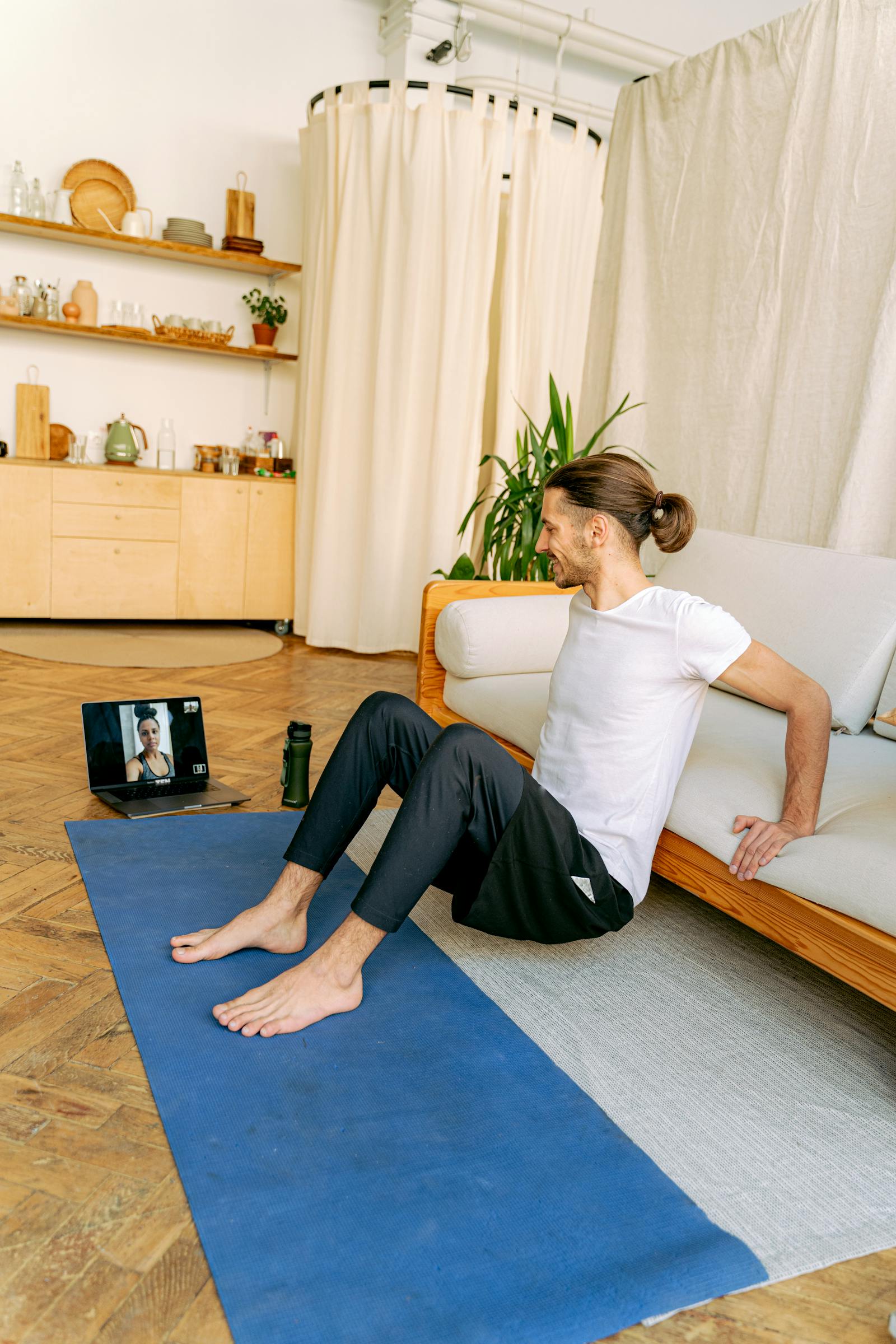 Member following a live virtual training session from home